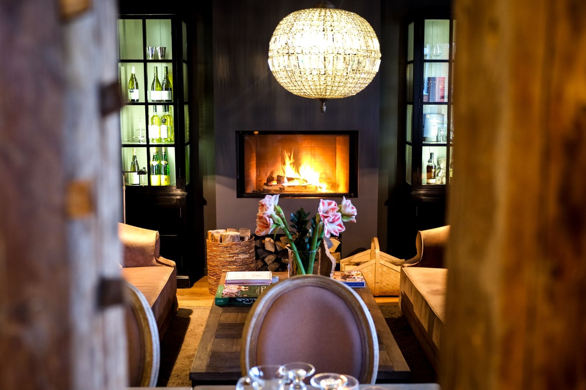 A warm and inviting living room with a fireplace and elegant decor in Estonia.